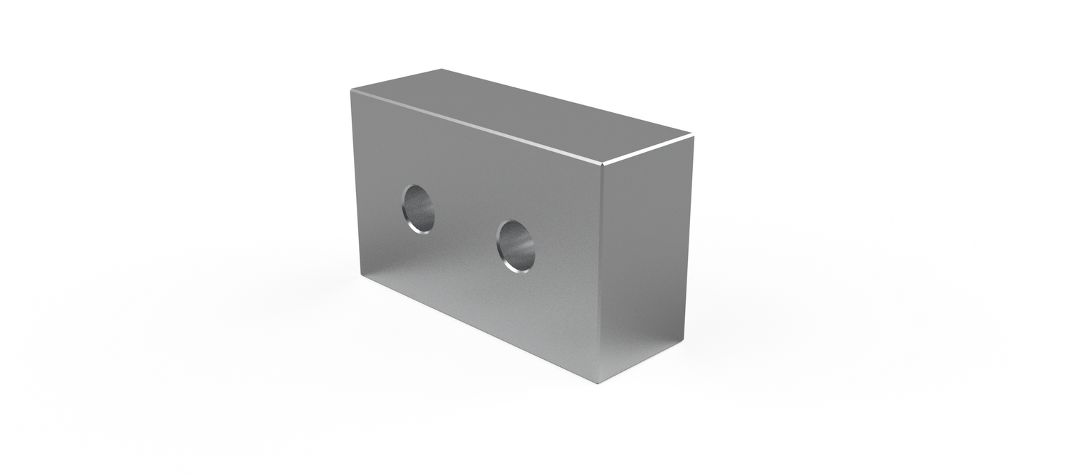 Metal block with two circular holes on a white background